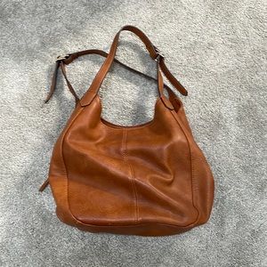 No longer use this super cute bag as I switched to diaper bags and mom purses!